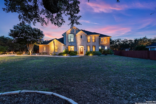 view of front of house with a lawn