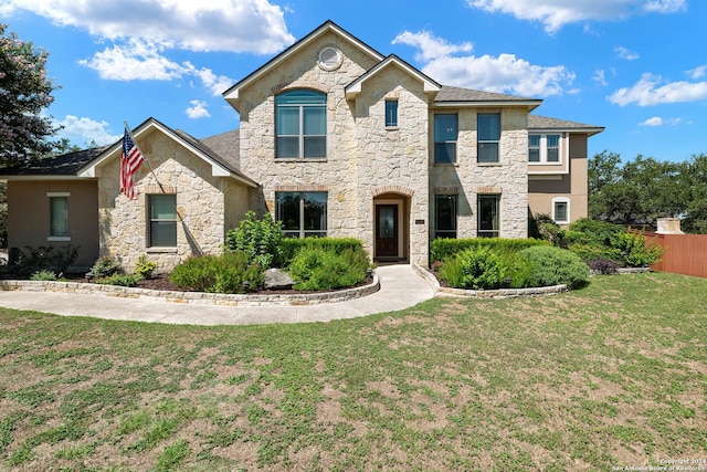 view of front of property with a front lawn