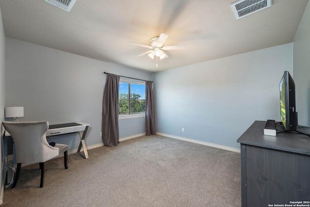 office area with ceiling fan and carpet