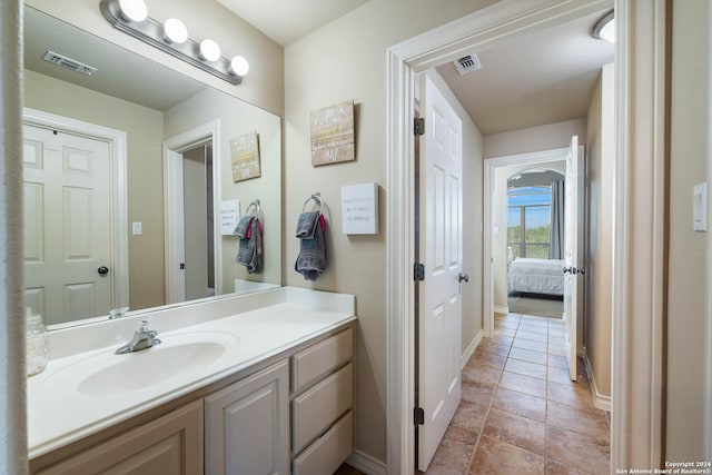 bathroom with vanity and tile patterned floors