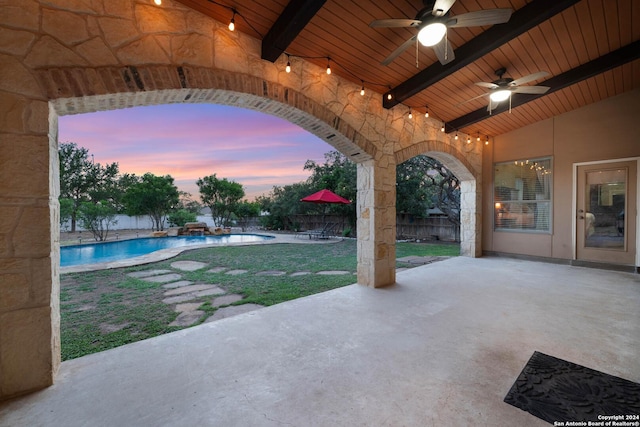 patio terrace at dusk with ceiling fan