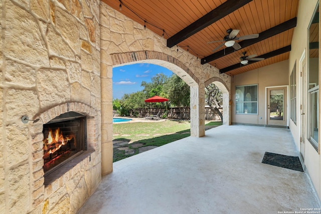 view of patio / terrace with an outdoor stone fireplace