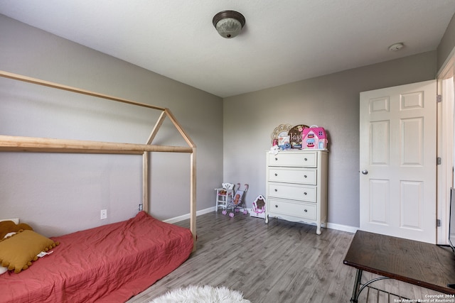 bedroom featuring hardwood / wood-style floors