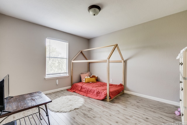 bedroom featuring light wood-type flooring