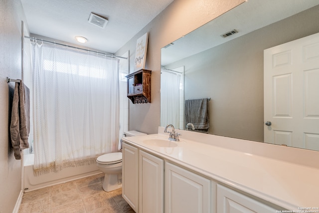 full bathroom with vanity, toilet, tile patterned flooring, and shower / tub combo