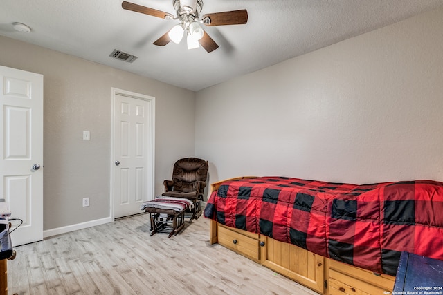 bedroom featuring wood-type flooring and ceiling fan