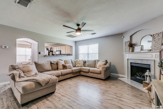 living room featuring a textured ceiling and hardwood / wood-style floors