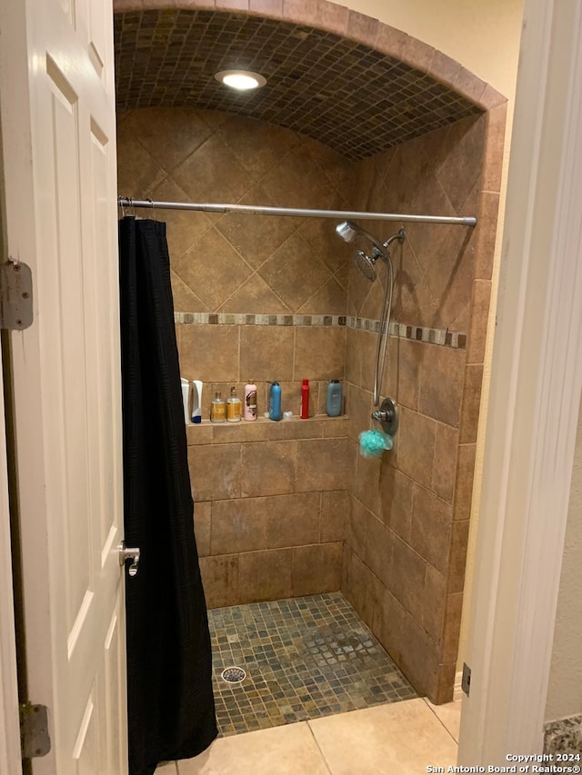 bathroom featuring a shower with shower curtain and tile patterned floors