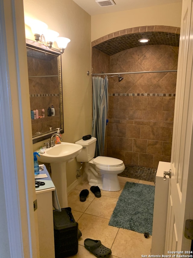 bathroom featuring tile patterned flooring and toilet