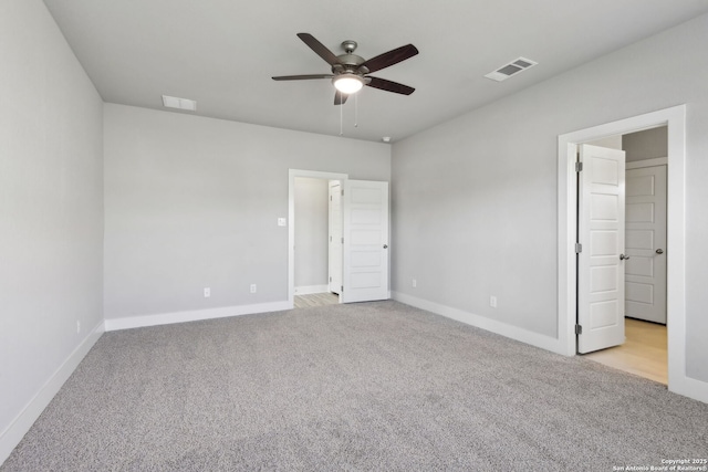 unfurnished bedroom featuring ceiling fan and light colored carpet