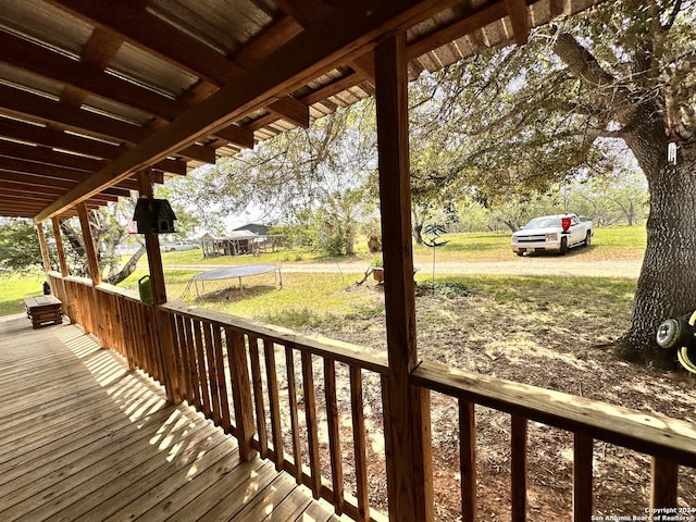 wooden terrace featuring a trampoline