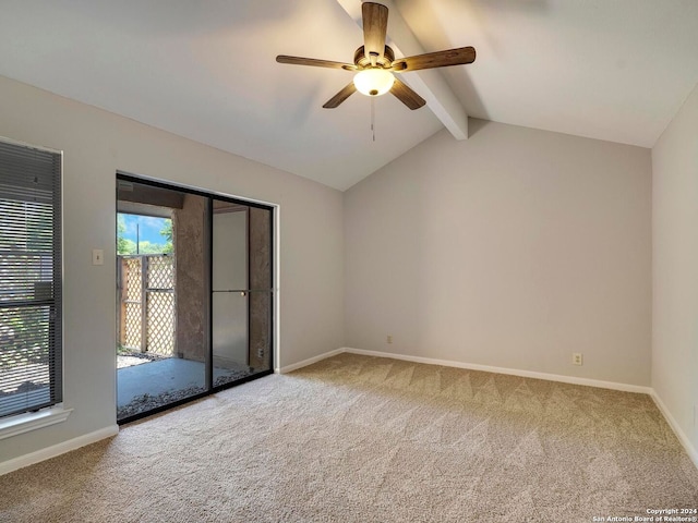 carpeted empty room with ceiling fan and vaulted ceiling with beams