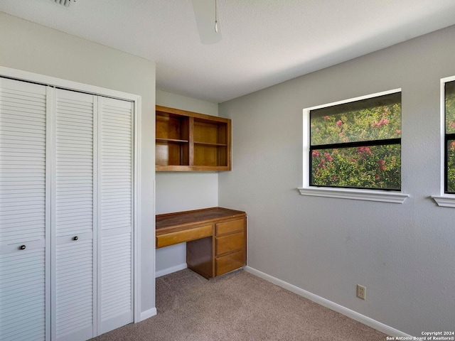 unfurnished bedroom with carpet and a closet