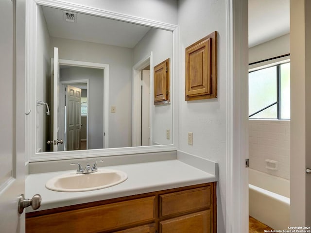 bathroom with shower / tub combination and vanity