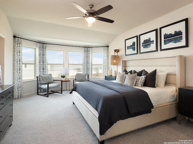 bedroom featuring ceiling fan, light carpet, and vaulted ceiling