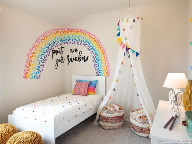 bedroom featuring vaulted ceiling and carpet flooring