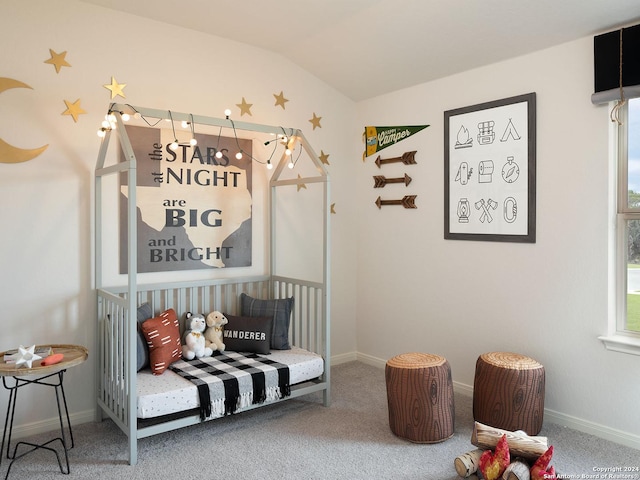 living area featuring carpet floors and lofted ceiling