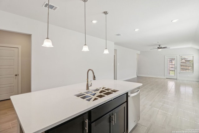 kitchen featuring dishwasher, pendant lighting, sink, and a center island with sink