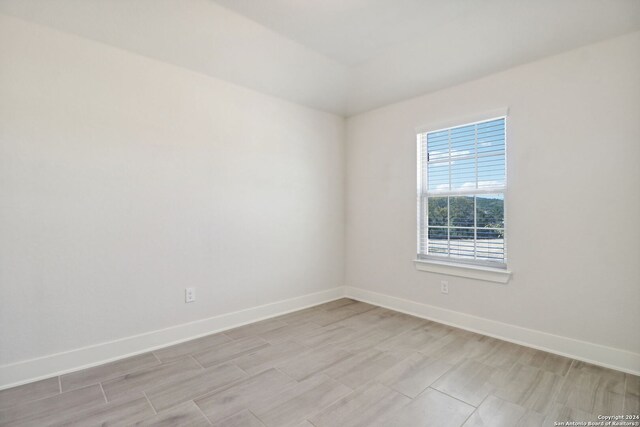 spare room featuring light wood-type flooring