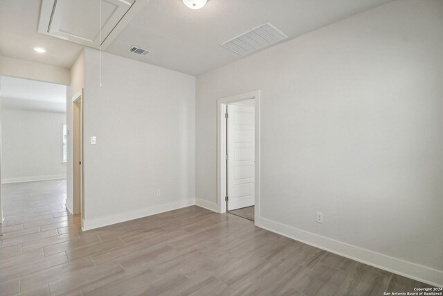 unfurnished room featuring light wood-type flooring