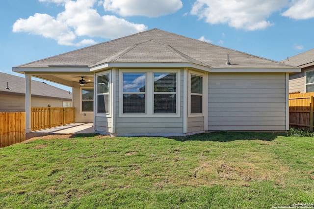 back of house with a patio area, a yard, and ceiling fan