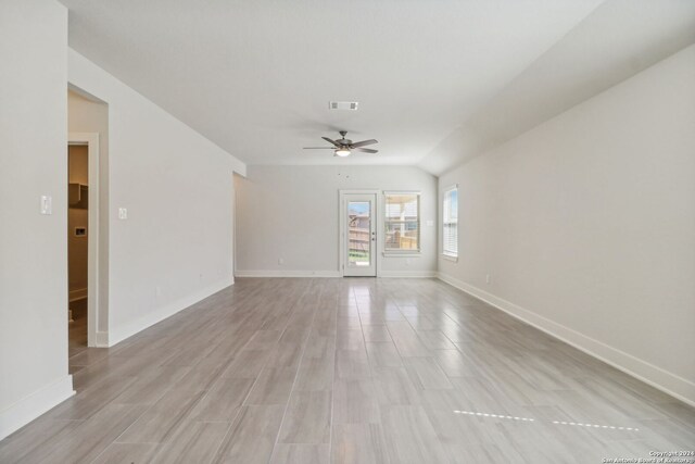 living room with hardwood / wood-style floors and vaulted ceiling