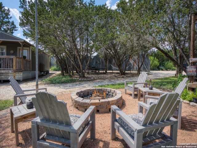 view of patio / terrace with an outdoor fire pit