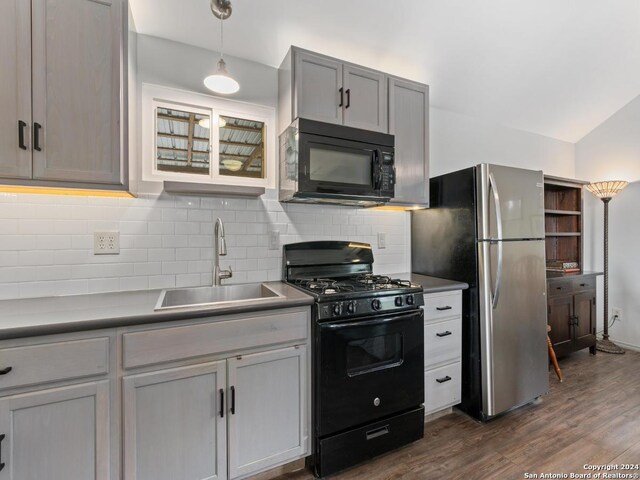 living room featuring sink, dark wood-type flooring, ceiling fan, and lofted ceiling