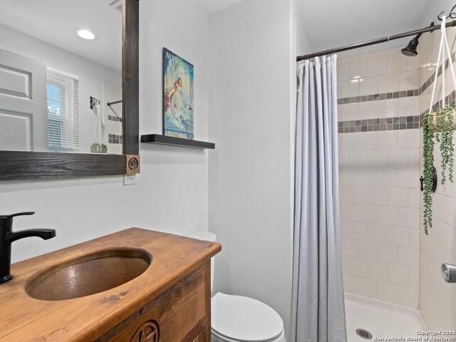 bedroom with a wall mounted air conditioner, light hardwood / wood-style flooring, and ceiling fan