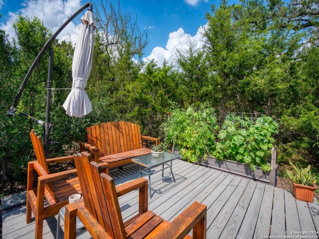 view of side of property with a wooden deck