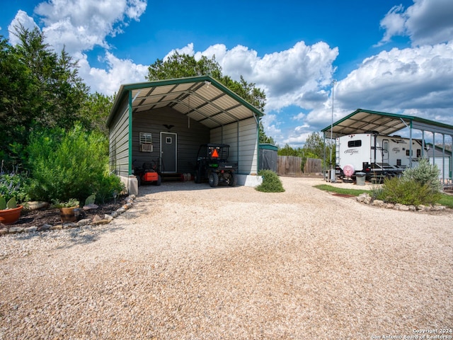 view of outbuilding featuring a carport