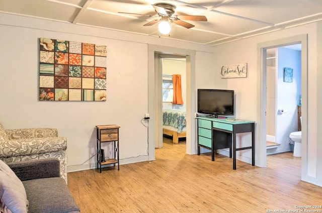 living area featuring ceiling fan and wood finished floors