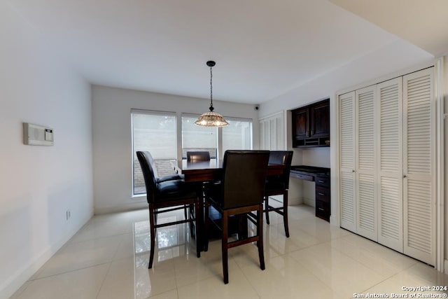 tiled dining room featuring a wealth of natural light