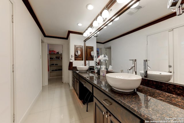 bathroom with vanity, tile patterned flooring, and crown molding