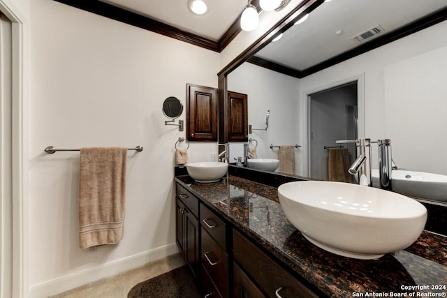 bathroom with vanity and crown molding