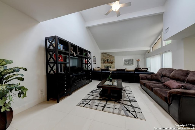 tiled living room featuring ceiling fan and lofted ceiling with beams