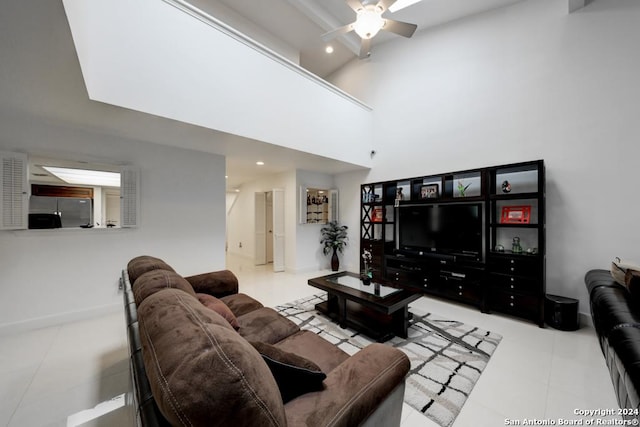 living room featuring ceiling fan and high vaulted ceiling