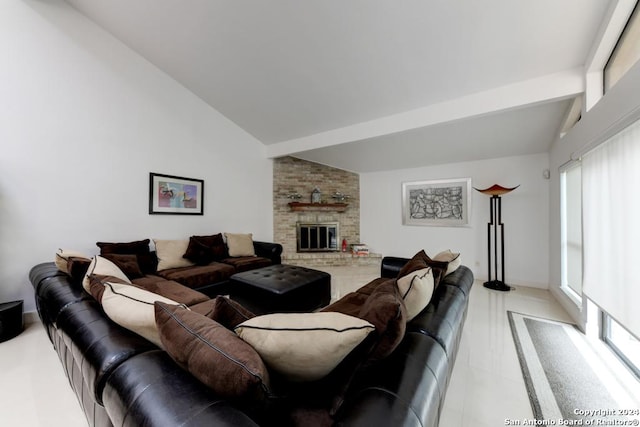 living room featuring vaulted ceiling with beams and a fireplace