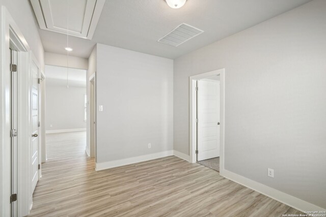 spare room featuring light hardwood / wood-style floors