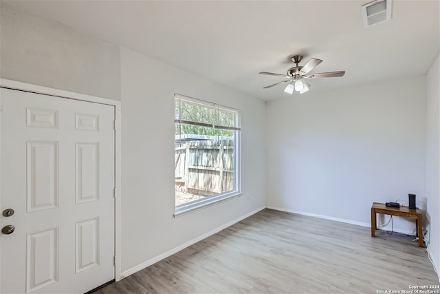 empty room featuring ceiling fan and light wood-type flooring