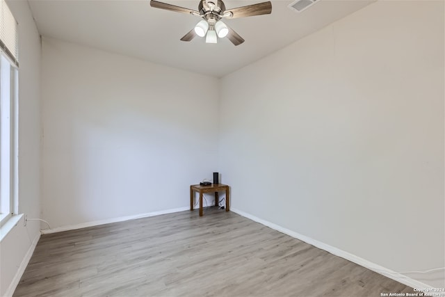 empty room featuring ceiling fan and light hardwood / wood-style flooring