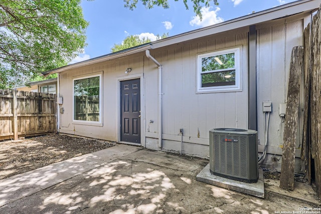 property entrance with a patio and central AC