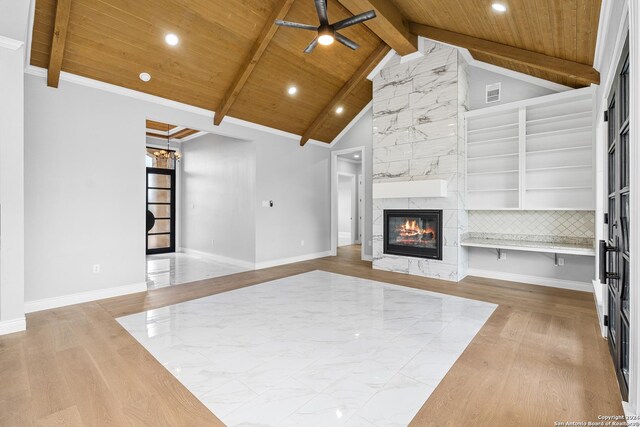 unfurnished living room with beamed ceiling, a fireplace, wooden ceiling, ceiling fan, and wood-type flooring