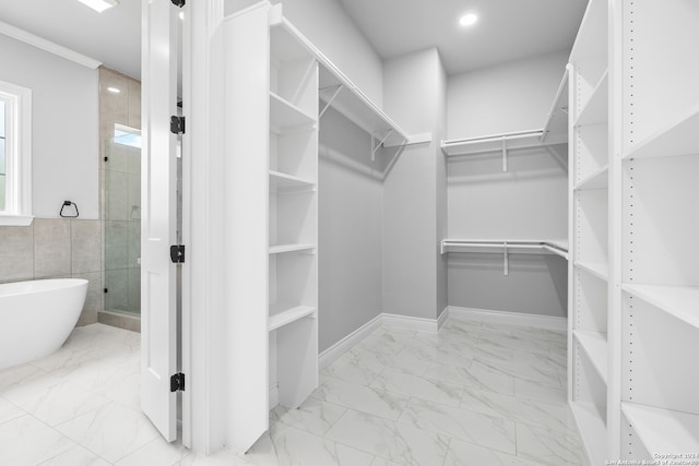 spacious closet with light tile patterned floors