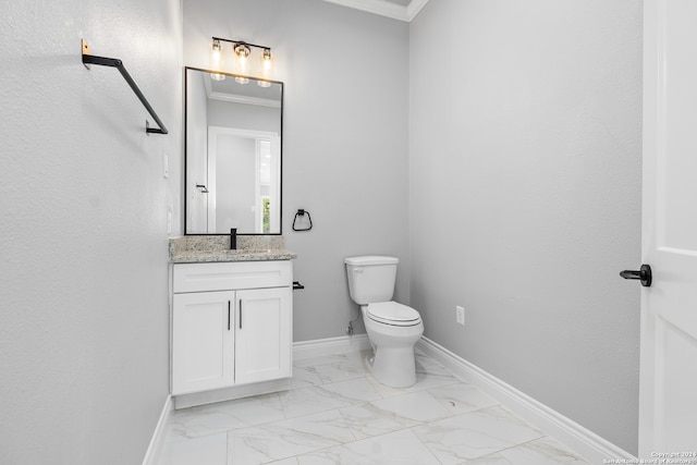 bathroom with tile patterned flooring, toilet, vanity, and ornamental molding