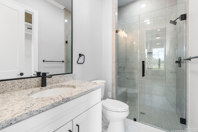 bathroom with vanity, toilet, tile patterned floors, and walk in shower