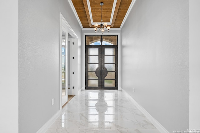 tiled foyer with wood ceiling, french doors, and a notable chandelier