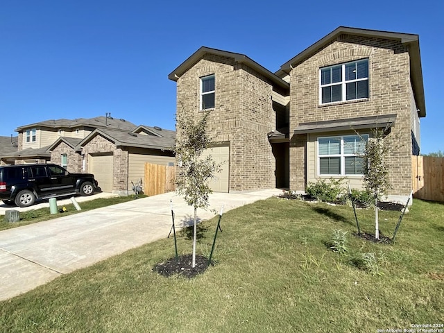 view of front of house featuring a garage and a front yard