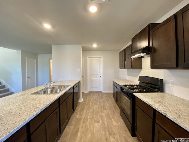 kitchen featuring black gas range, dishwasher, exhaust hood, sink, and light hardwood / wood-style flooring