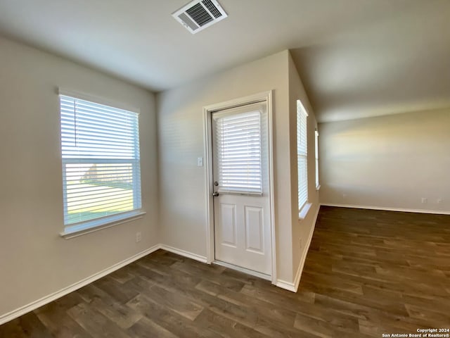 doorway featuring dark wood-type flooring